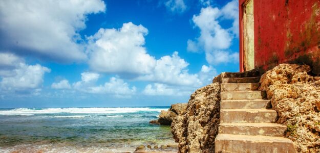 Seaside stone steps leading to ocean.