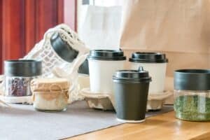 Eco-friendly coffee cups and jars on display.