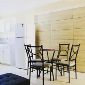 Modern kitchen dining area with table and chairs.